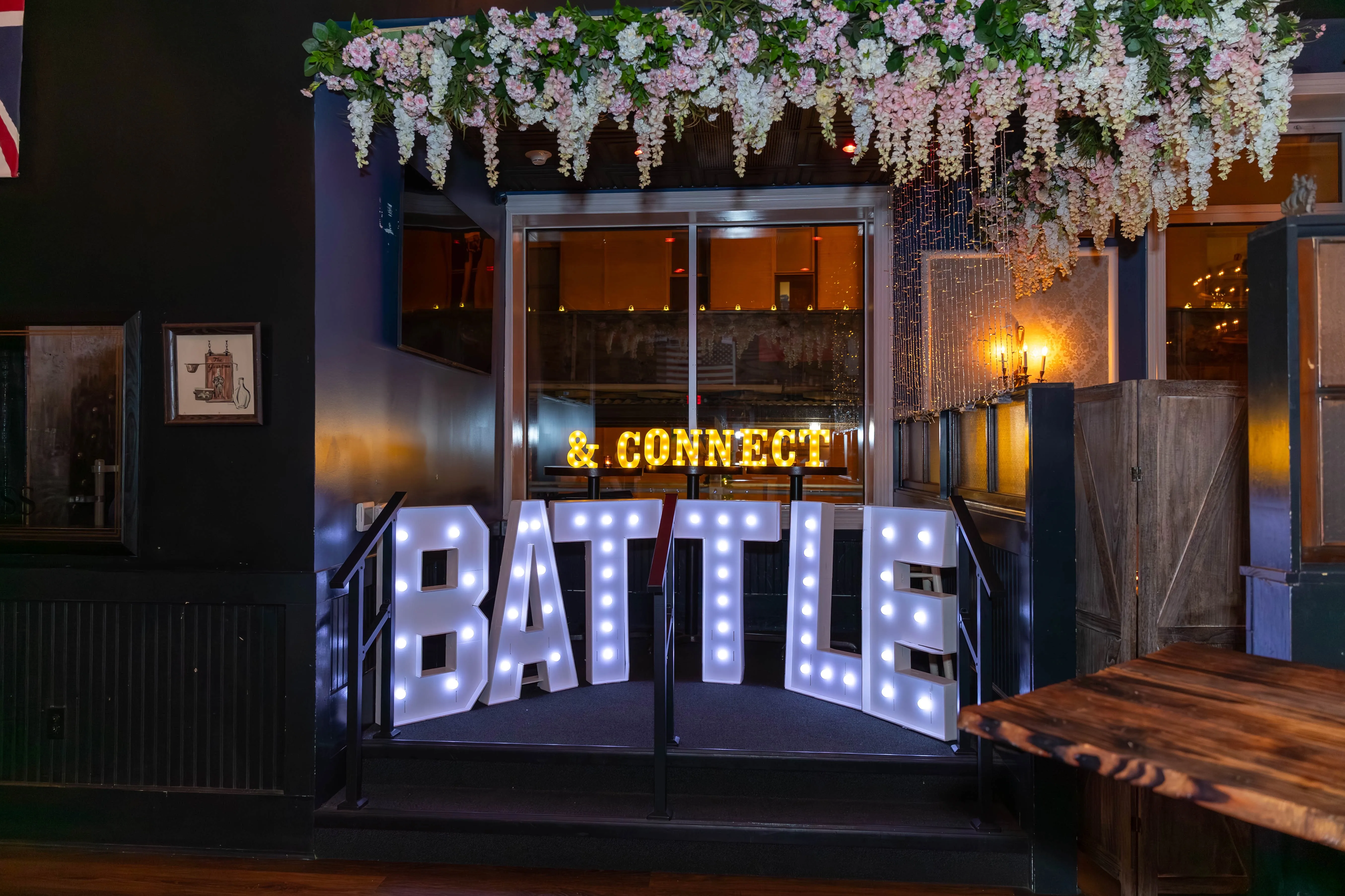 Anthony Battle in conversation with professionals during a networking event