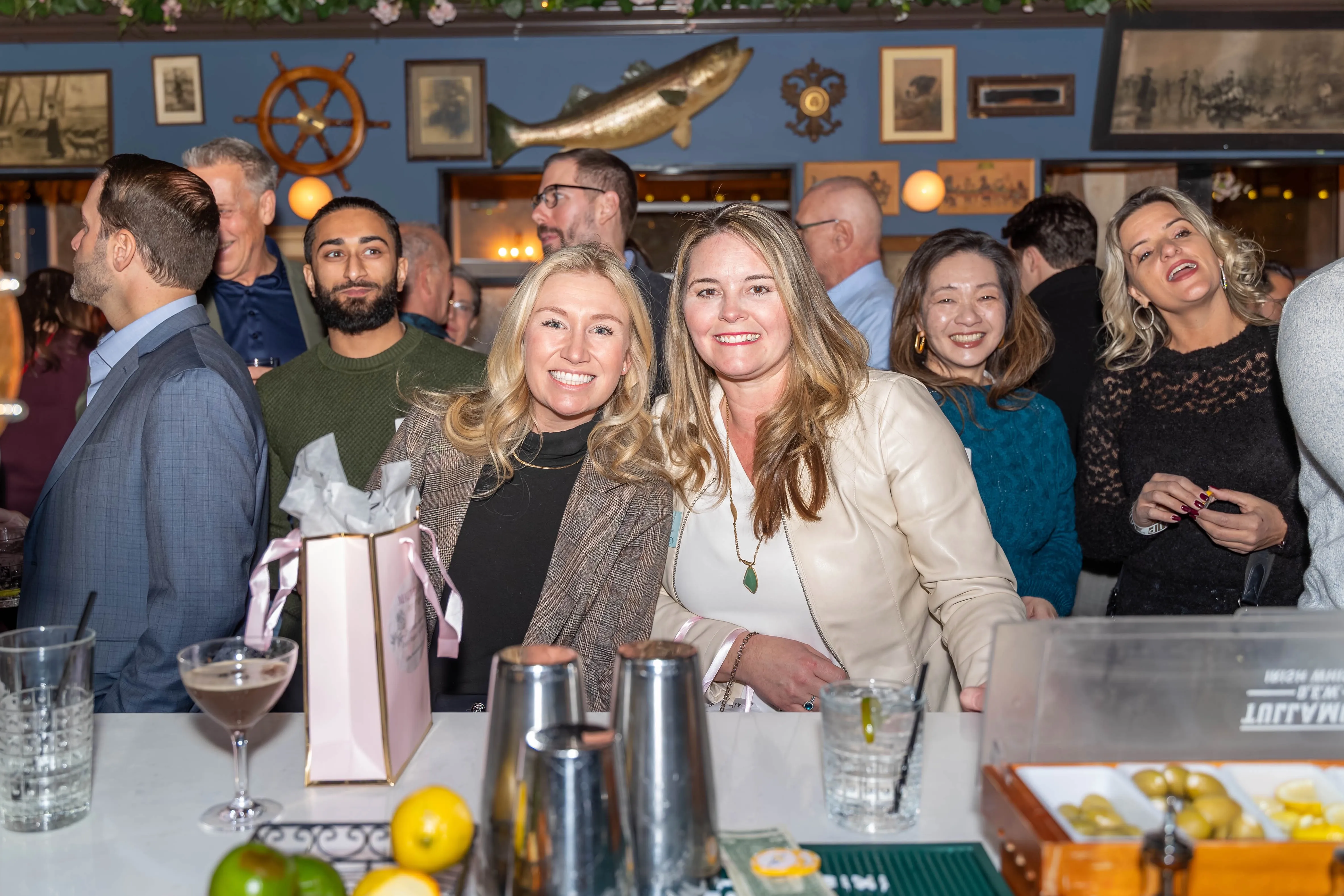 Attendees talking near the bar during a Battle Connects event