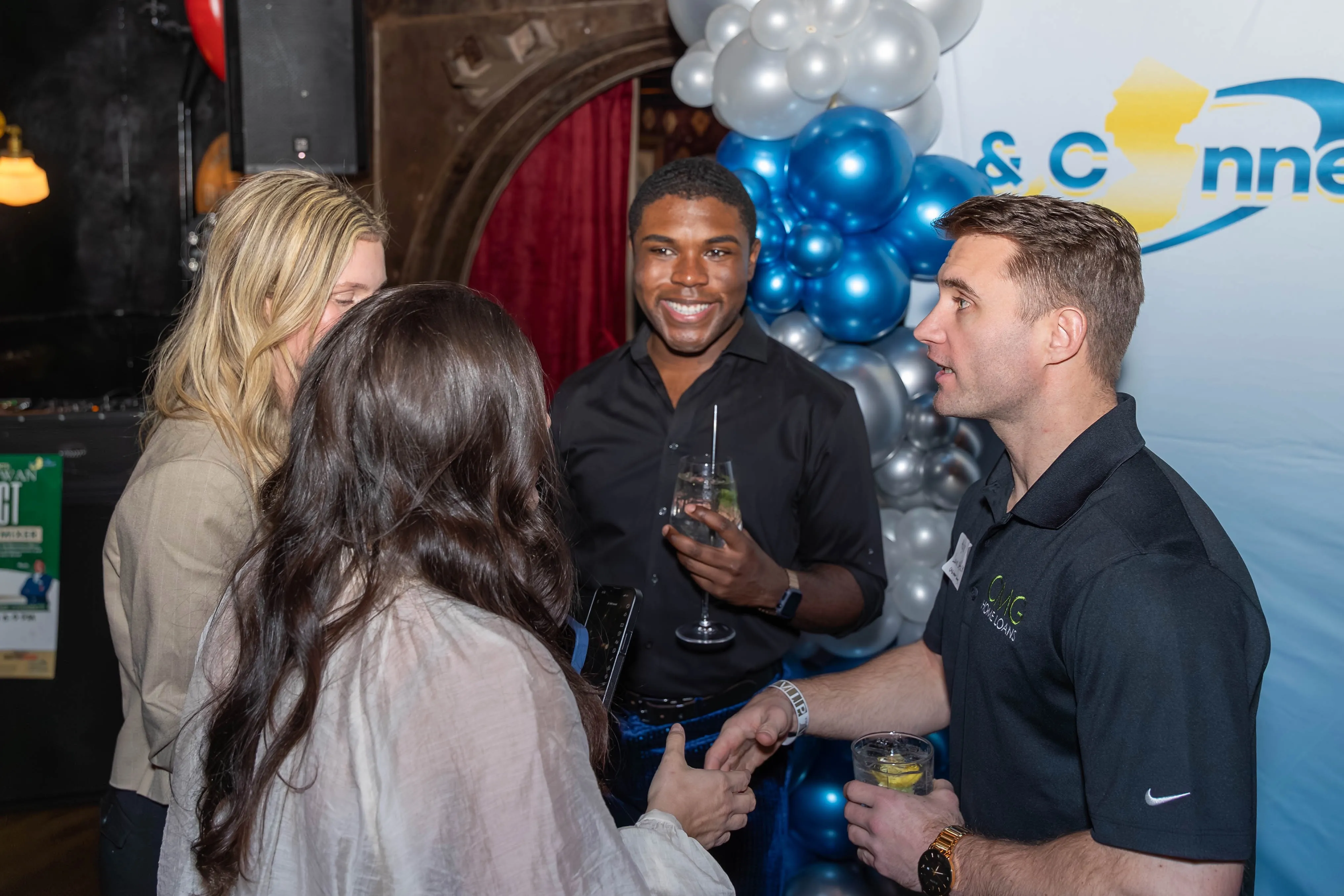 Anthony Battle and attendees networking in a Battle Connects event